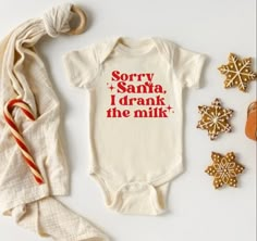 Introducing our "Sorry Santa Christmas Natural Bodysuit for Babies," a playful and adorable addition to your little one's holiday wardrobe! Key Features: Design: Whimsical "Sorry Santa" message in a festive and playful font, perfect for adding humor and charm to the holiday season. Material: Soft and gentle fabric for ultimate comfort, ensuring a cozy feel against baby's delicate skin. Fit: Classic bodysuit design with snap closures for easy dressing and diaper changes. Versatility: Ideal for ho Thanksgiving Baby Shirt, Christmas Onesie Cricut, 1st Christmas Shirt, Infant Christmas Shirts, Diy Christmas Onesie, Funny Christmas Onesies, Cricut Kids Christmas Shirts, Christmas Toddler Shirt, Baby Vinyl Projects