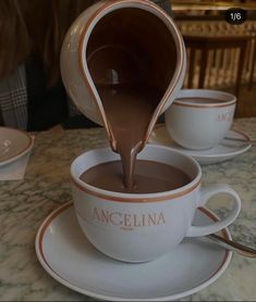 chocolate being poured into a coffee cup