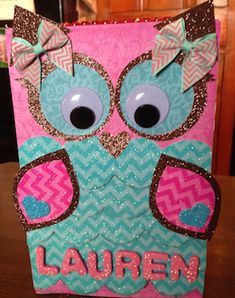 a pink and blue card with an owl on it's face that says lauren