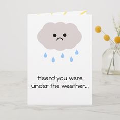 a card with an image of a rain cloud and the words heard you were under the weather