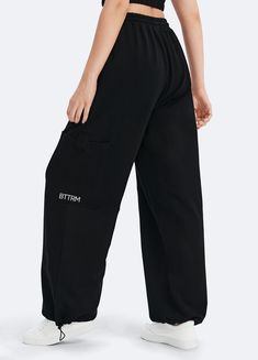 Embrace roomy wide legs and a stretchy fit for ultimate comfort, paired with a flattering high waist for added style. Whether it's grocery runs, lazy Sundays, or a casual hangout, these joggers have you covered in relaxed elegance. Black Wide Leg Athleisure Joggers, Black Wide Leg Joggers For Athleisure, High Waist Cargo Sweatpants With Relaxed Fit, Baggy High Waist Sweatpants For Sports, Stretch Wide-leg Athleisure Joggers, Trendy Baggy Wide Leg Joggers, Trendy Wide Leg Sports Bottoms, Black Relaxed Fit Joggers With Cargo Pockets, Comfortable Wide Leg Bottoms For Streetwear