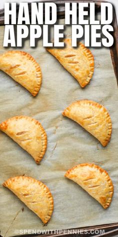 homemade hand - held apple pies on a baking sheet with the title above it