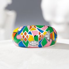 This ring plays with overlapping organic and geometric shapes, creating depth and cohesive yet complex composites of contrasting shapes and color schemes. Find twinkling stones nestled within this unique and avant-garde design. The accessory gives just the right pop of color to any outfit.Weight: 6.31 gMaterial: Plating Color: Modern Multicolor Enamel Jewelry, Modern Multicolor Geometric Jewelry, Modern Multicolor Jewelry With Unique Variations, Modern Multicolor Jewelry With Bold Design, Unique Multicolor Geometric Jewelry, Organic And Geometric Shapes, Home Wedding, Watch Design, Quality Jewelry