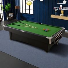 a pool table in a room with blue walls