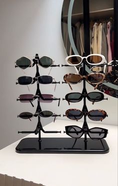 an eyeglass display with sunglasses on it