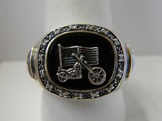 BGE Bradford Exchange 925 sterling silver black onyx diamond freedom biker ring Sz 10.5. It can be easily re-sized by a local jeweler. The ring is set with a sterling motorcycle & American flag on a polished black onyx gemstone surrounded by 14 genuine diamonds. The setting measures 7/8" by 3/4". The ring is marked BGE 925 and weighs 14.8 grams. BIN (Buy It Now) for only 79.99. Super-size pictures for close-up details. Please remember most all my items are vintage & estate found, therefore do not expect perfection, as they may show some signs of wear or imperfections only adding to the character and authenticity. I do my best to accurately describe and photograph all my items. Please message me with any questions. Thank You!. Biker Style Sterling Silver Jewelry For Biker Events, Black Biker Rings For Biker Events, Black Biker Style Ring As Gift, Silver Biker Jewelry As A Gift, Vintage Nickel-free Skull Ring For Gift, Luxury Hallmarked Onyx Rings, Bradford Exchange, Biker Rings, Onyx Gemstone