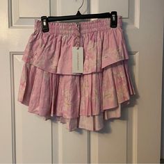 Brand New! Loveshackfancy Ruffle Mini Skirt - Blush Pink. Gorgeous Pink Floral, Classic Loveshackfancy Style - A Little Longer In The Back, Shorter In The Front, Shorter On The Sides. Current Style, Size Small Is Sold Out! Please See My Other Listings! Bundle Discounts, Shipping Discounts Available And I Consider Any Reasonable Offer! My Listings Are From Our Home, Not Thrifted - I’d Love To Work With You To Pass On Anything You Love! Pink Tiered Summer Skirt, Pink Ruffled Skirt Bottoms For Brunch, Pink Feminine Skirt For Vacation, Pink Ruffled Bottoms For Brunch, Feminine Pink Skirt For Vacation, Feminine Pink Skirt For Brunch, Pink Ruffled Skirt For Day Out, Pink Feminine Skirt With Ruffle Hem, Pink Ruffle Hem Bottoms For Brunch