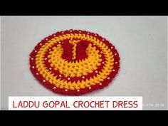 a red and yellow crochet pattern with the letter i on it's center