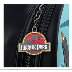 Step into the adventurous world of Jurassic Park with this vibrant anime-themed backpack. Perfect for fans of the iconic movie series, this backpack combines practicality with an eye-catching design, ideal for daily use, school, or travel. Material: Made from durable PU material, ensuring longevity and resilience. Special Features: Features a spacious main compartment, a front zipper pocket, and adjustable padded shoulder straps for comfort. Technical Specifications: Dimensions are 27 cm in heig Themed Backpack For Cosplay, Disney Backpack For School With Case Included, Disney Backpack With Case For School, Themed Black Backpack For Theme Parks, Black Backpack For Theme Parks, Back To School Backpack For Theme Park, Themed Backpack For Theme Park, Themed Standard Backpack For Theme Park, Disney Backpack For Theme Park And Back To School