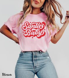 Get festive and flirty with our Santa Baby shirt, featuring "Santa Baby" in a cute retro font topped with an adorable Santa hat. This cozy Comfort Colors shirt is perfect for adding a playful touch to your holiday wardrobe. Whether you're heading to a Christmas party or just embracing the season's spirit, this Christmas Santa Baby tee is a must-have for women who love fun and stylish holiday looks. Perfect as a Christmas party shirt for women or a go-to pink Christmas Santa tee, it's the ultimat Santa Baby Shirt, Pink Christmas Shirt Ideas, Baby Christmas Shirt, Santa Tee, Christmas Party Shirts, Cute Santa, Santa Shirts, Tshirt Ideas, Holiday Wardrobe