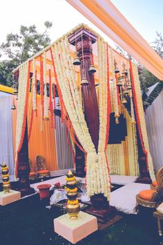 an outdoor ceremony with flowers and decorations