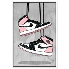 two pink and black sneakers hanging from strings on a gray background with the words air jordan written