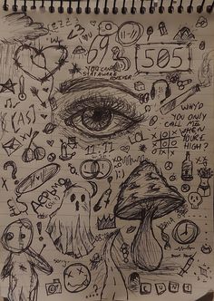 a notebook with some drawings on it and an eye in the middle, surrounded by other doodles