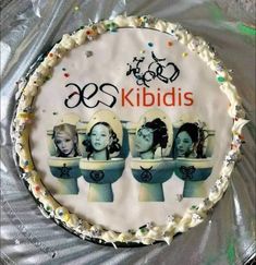 there is a cake with pictures of women in the bathroom on it and an advertisement for kripidis