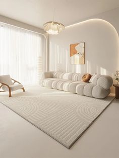 a living room with white furniture and large curtains on the window sill, along with a rug that looks like waves