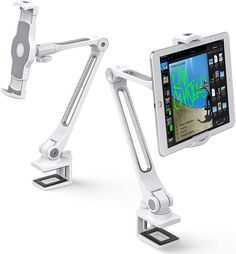 an ipad and tablet holder are attached to the arm of a desk lamp that is holding a computer monitor