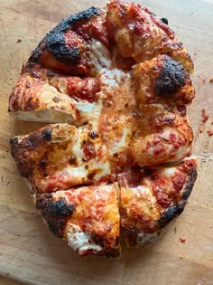 a pizza that is sitting on a cutting board