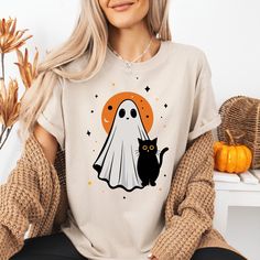 Vintage Halloween T-Shirt, Retro Ghost T-Shirt,Retro Halloween T-Shirt,Cute Ghost T-Shirt,Vintage Ghost T-Shirt,Gift for Women,Birthday Gift **Product Specifications**   We take pride in using only the highest quality brands for our printing, exclusively utilizing Bella Canvas and Gildan SoftStyle. *Bella Canvas*   - Available in unisex sizing   - Lightweight at 4.2 oz.   - Solid colors are made from 100% Combed and Ring-Spun Cotton.   - Athletic Heather contains 90% Combed and Ring-Spun Cotton, 10% Polyester.   - Heather CVC Colors are a mix of 52% Combed and Ring-Spun Cotton with 48% Polyester.   *Gildan SoftStyle*   - Unisex sizes available   - Sport Gray: 4.5 oz/yd² | 90% Ring-Spun Cotton / 10% Polyester   - Heather Navy, Heather Maroon, Heather Galapagos Blue, Dark Heather: 4.5 oz/yd² Retro Halloween T-shirt With Character Print, Retro Halloween T-shirt With Crew Neck, Retro Halloween T-shirt Pre-shrunk, Retro Pre-shrunk Halloween T-shirt, Retro White Halloween T-shirt, Halloween Graphic Tee With Cartoon Print, Vintage Halloween T-shirt With Letter Print, Halloween Cartoon Print Graphic Tee, Vintage Halloween T-shirt With Character Print