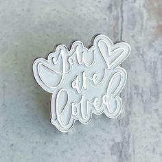 a white sticker with the words girl or love on it