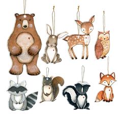 an assortment of animal ornaments hanging from strings