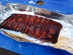 a piece of meat sitting on top of aluminum foil