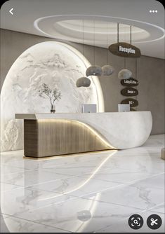 an image of a reception area in a modern office building with marble flooring and white walls