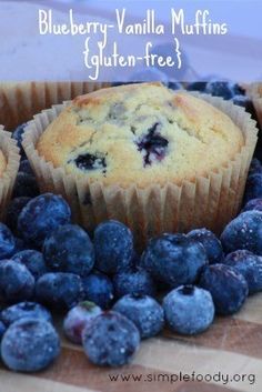 blueberry vanilla muffins gluten - free on a cutting board with fresh blueberries