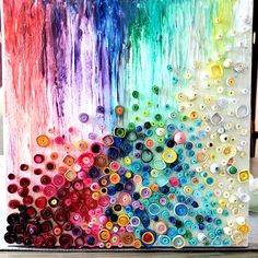 an art project made with buttons and watercolors