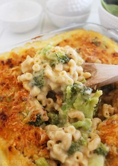 a casserole dish with broccoli and macaroni in it, ready to be eaten