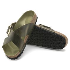 Classic Slide Sandals With Buckle Closure, Classic Slip-on Sandals With Tang Buckle, Classic Footbed Sandals With Tang Buckle And Round Toe, Classic Open Toe Footbed Sandals With Tang Buckle, Classic Double Strap Footbed Sandals With Buckle, Classic Double Strap Footbed Sandals With Leather Sole, Classic Open Toe Slides With Adjustable Strap, Classic Double Strap Leather Footbed Sandals, Classic Leather Double Strap Footbed Sandals