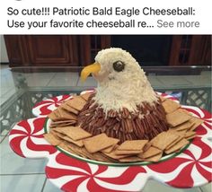 a cake made to look like an eagle sitting on top of crackers