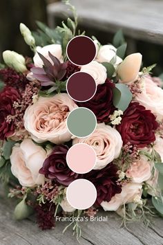 a bridal bouquet with roses and greenery is shown in shades of burgundy, pink, green