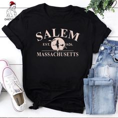 ✔️ NAME: Salem Massachusetts Shirt, Spooky Shirt, Witch Halloween Graphic Tee, Halloween Party Shirt, Salem Witches Shirt, Halloween Witchy Clothing ✔️ IMPORTANT NOTE: Both Men and Women can we our shirts because this is unisex style t-shirts;  Wash item inside out in cold water, do not bleach, do not dry clean, do not iron directly on the design. ✔️ MATERIAL: 5.3-ounce, 100% cotton (99/1 cotton/poly (Ash) & 90/10 cotton/poly (Sport Grey); Heavyweight classic unisex tee; Taped neck and shoulders Cotton Tops With Letter Print For Costume Party, Salem Witches, Witchy Clothing, Salem Massachusetts, Halloween Graphic Tees, Halloween Graphic, Streetwear Tops, Witch Halloween, Tee Shirt Designs