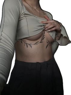 a woman with tattoos on her stomach