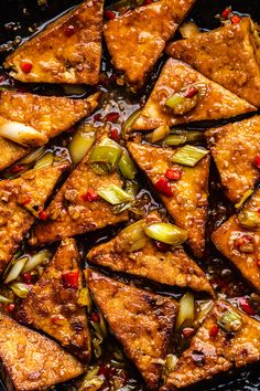 some food is cooking in a pan on the stove top and ready to be eaten