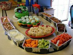 several trays filled with different types of food on top of a kitchen counter next to each other