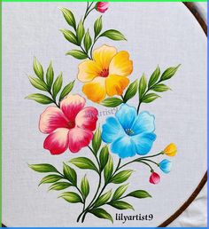 an embroidery project with flowers painted on it