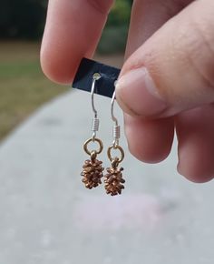 Tiny pinecone earrings I hand make/assemble all of my products so all are subject to imperfections Pinecone Earrings, Jewelry Inspo, Pine Cones, Jewelry Earrings Dangle, Dangle Drop Earrings, Dangle Earrings, Jewelry Earrings, Im Not Perfect, Drop Earrings