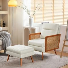 a white chair and ottoman in a living room