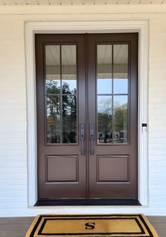 two double doors with sidelights on the front of a house