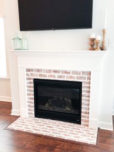 a fireplace with a flat screen tv above it