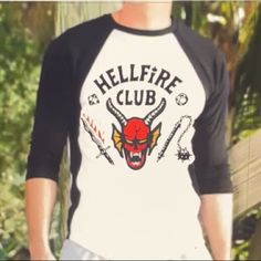 Stranger Things Hellfire Club T Shirt Edgy White Crew Neck Shirt, Punk Style White Cotton Shirt, White Cotton Punk Shirt, White Punk Style Fan Merchandise Top, White Long Sleeve Punk T-shirt, Edgy White T-shirt For Halloween, Stranger Things Hellfire Club, Stranger Things Hellfire, Hellfire Club