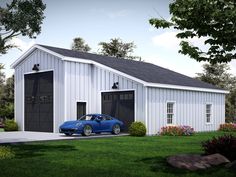 a blue car is parked in front of a white garage with black doors and windows