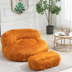 an orange chair and ottoman in a living room