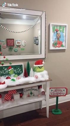 the grinch christmas decorations are on display in front of a mirror and other items