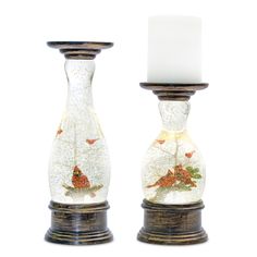 two glass candlesticks decorated with butterflies