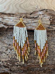 Stunning, delicate seed bead earrings with chevron pattern, with a white foundation and gold-tipped edges ready to catch the light and capture the eye. Handmade with fine Czech glass beads and gold-plated findings. Bohemian White Tassel Earrings With Tiny Beads, White Bohemian Tassel Earrings With Tiny Beads, Bohemian White Beaded Fringe Earrings, Elegant White Beaded Earrings For Festivals, White Bohemian Jewelry With Latkans, Bohemian White Jewelry With Latkans, White Adjustable Bohemian Beaded Earrings, Bohemian Earrings With Gold Beads And Adjustable Fit, White Foundation