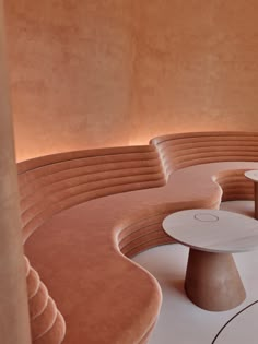 the circular seating area is made up of different shapes and sizes, including round tables