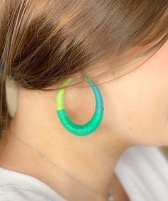 Our Ooo Baby Baby Raffia Wrapped Hoop Pin Catch Earrings are the perfect accessory to complete any outfit. The earrings feature shades of green raffia wrapped around a hoop design, adding a fun and playful touch to your look. Measuring at 2" in length, these earrings are the perfect size to make a statement without being too heavy or cumbersome. The pin catch design ensures that the earrings will stay securely in place, while also making them easy to put on and take off. These earrings are lead Wrapped Hoop Earrings, Hoop Design, Baby Baby, Shades Of Green, Put On, Sensitive Skin, Jewelry Collection, Hoop Earrings, Shades