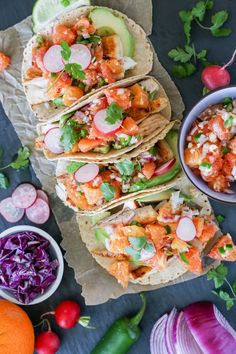 shrimp tacos with cilantro, red cabbage, and avocado salsa